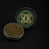 Open tin of PRL Siberian sturgeon caviar beside its green PRL monogram lid on a black background